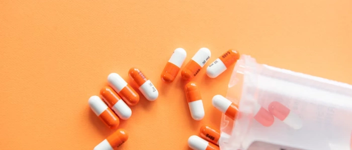Pharmacist managing medication inventory with pharmacy management software