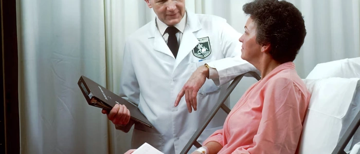 Nurse monitoring patient vitals remotely through an RPM platform