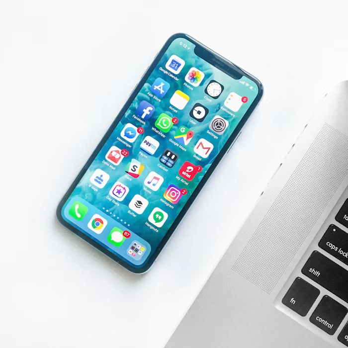 Hand holding a smartphone with a healthcare app for booking doctors