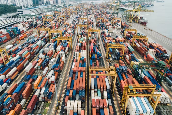Logistics team tracking shipments on a warehouse dashboard