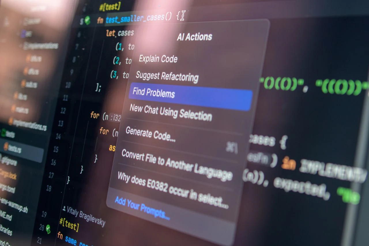 Dark code editor and terminal output on screen, representing software testing workflows