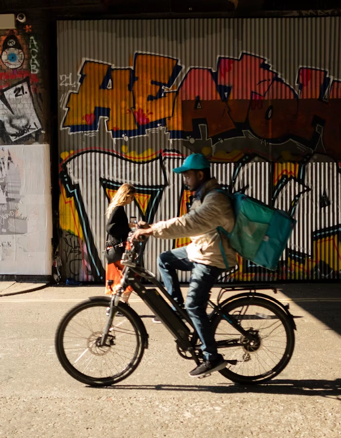 Delivery courier riding through the city for a grocery delivery app