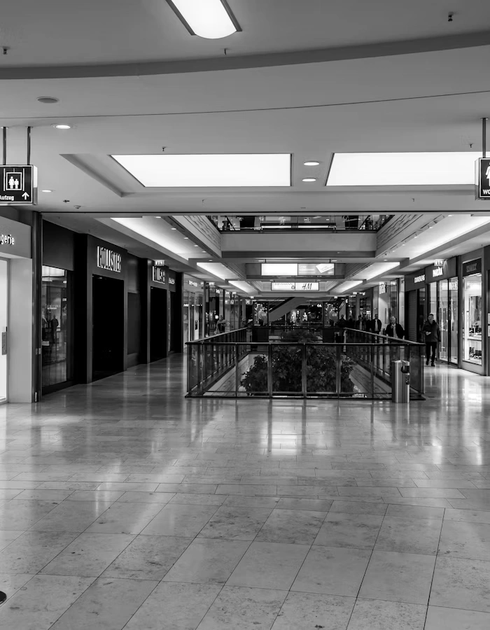 Mall corridor with multiple storefronts representing a vendor marketplace