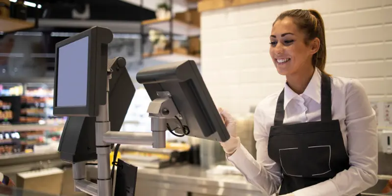 restaurant employee using POS system