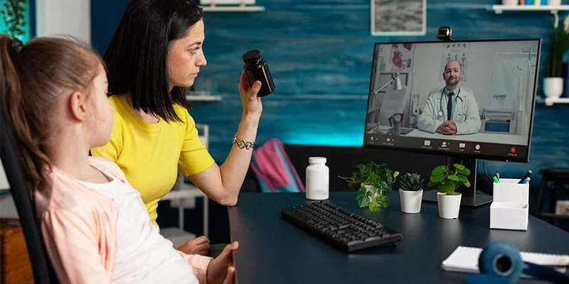 A patient at home connected to a doctor via a tablet